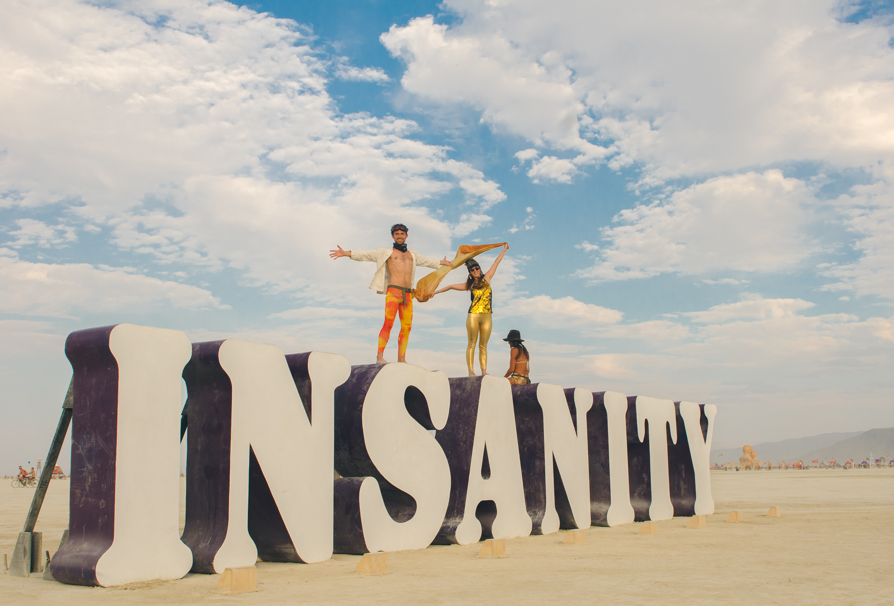 Me in gold tights, feeling blissfully happy to be on top of Insanity, on the Playa, at Black Rock City.