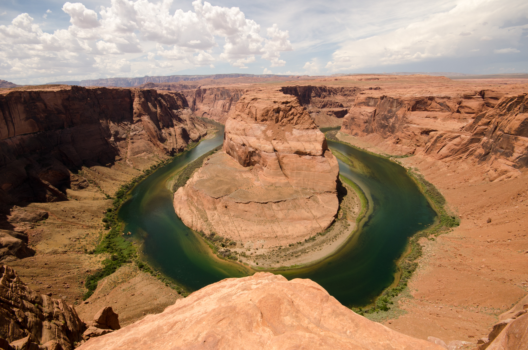 Horseshoe Bend in Arizona: no fences and just a sheer drop into the Colorado River. Frightening to watch people take photos of their toddlers standing right on the edge.